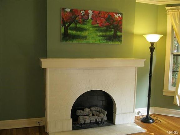 Gas burning fireplace in the living rooms provides an elegant focal point.