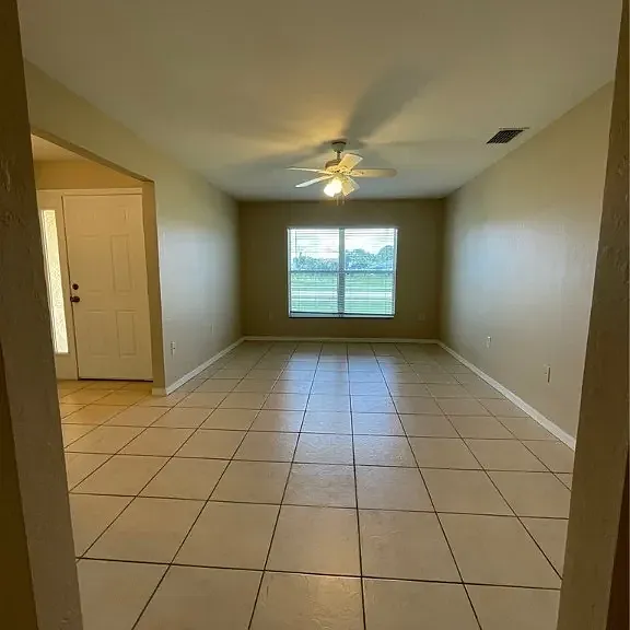 front door view and view of open room
