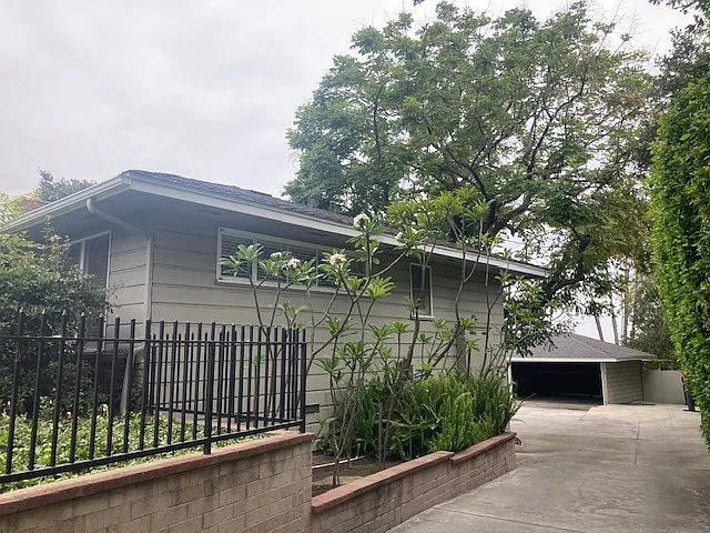 Side view of unit with carport at rear
