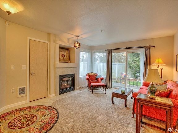 Living room with cozy gas fireplace, included in the HOA dues. 