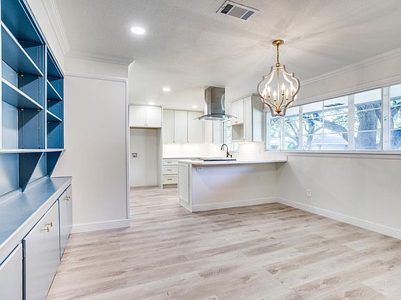 Big eat in kitchen with all new lighting, cabinets and appliances.