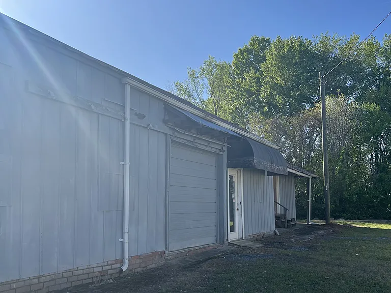 Exterior roll up door and side entrance