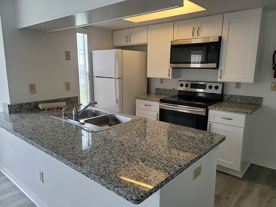 Brand new kitchen cabinets, granite countertops, and floor.