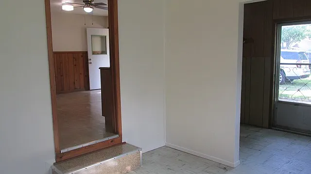 DEN 
DOOR TO KITCHEN ON LEFT 
LAUNDRY ROOM WITH BACKDOOR ON RIGHT