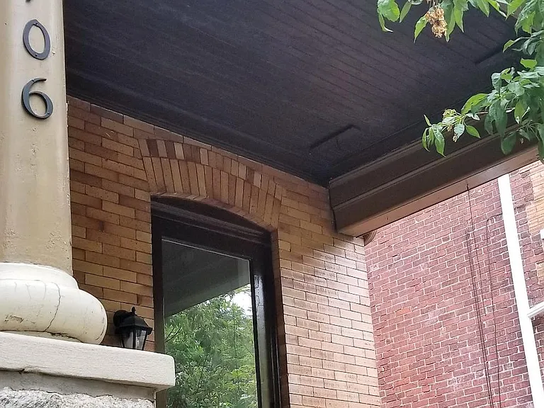 Deep covered front porch perfect for hanging outside.