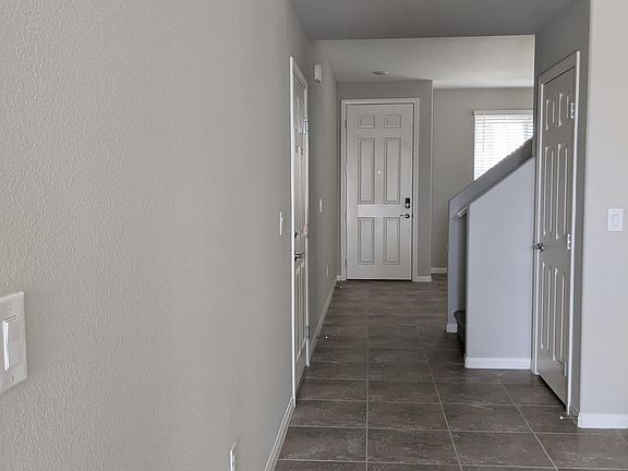 Front door, garage door, and stairway