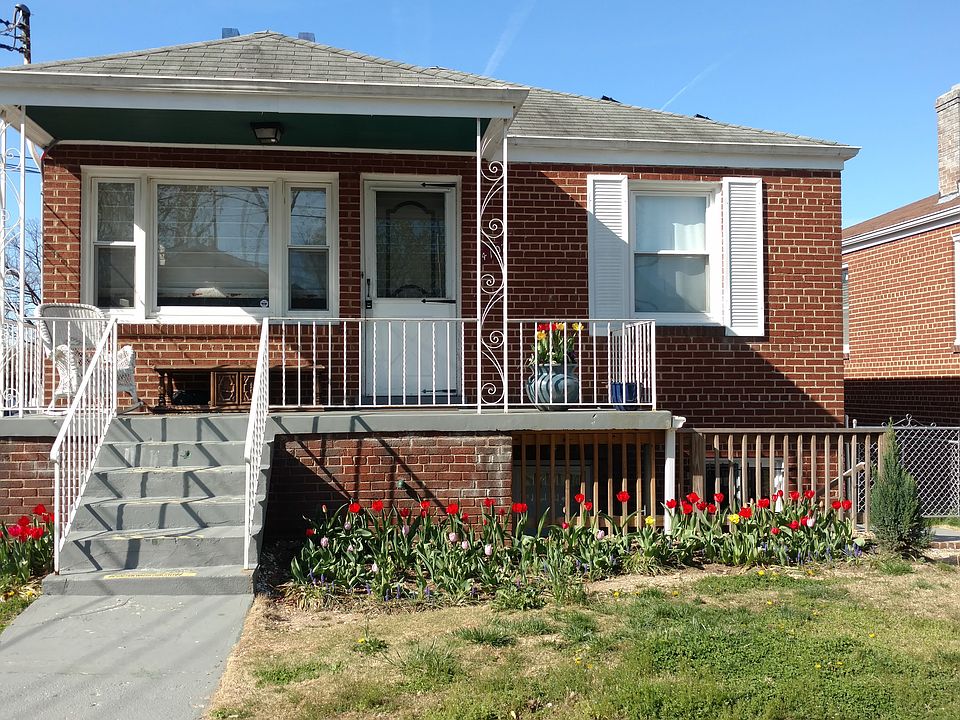 View from the front with basement entrance on the right