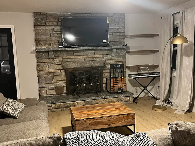 Wood burning fireplace in living area