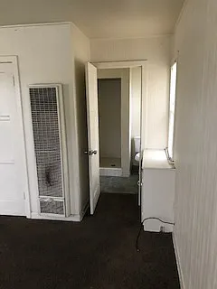 Bathroom with toilet & stall shower, no bath tub.