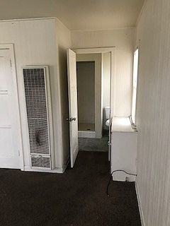 Bathroom with toilet & stall shower, no bath tub.