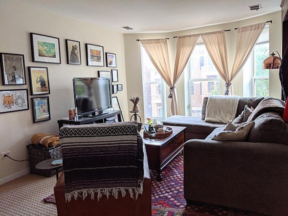 Living room overlooking Sheffield Ave and facing east. Tons of sunlight and plenty of space for an L-Shape couch, table and chair.
