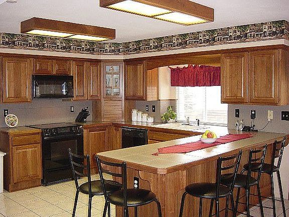 Upgraded kitchen with Italian tile floor.