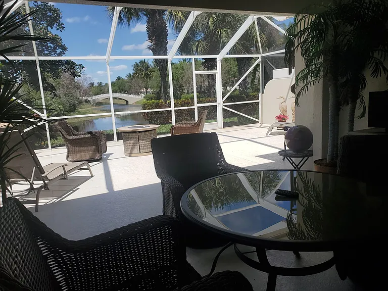 Covered lanai with TV on canal with a view of a Verona bridge