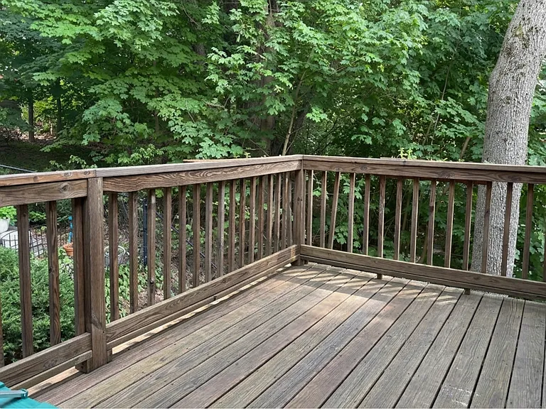 Large private deck overlooking owner's back yard. Lots of green space. Deck large enough to put outdoor sofas and dining room table.