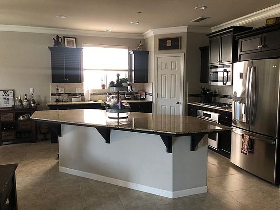 Open floor plan, kitchen with large pantry.