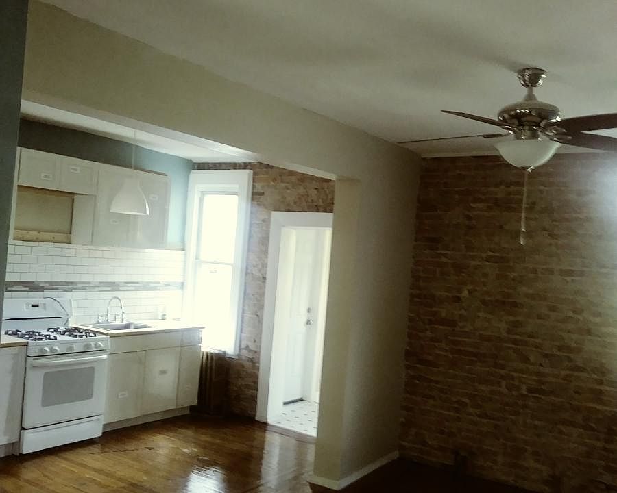 Open kitchen with exposed brick