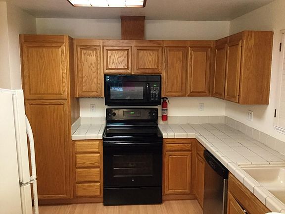 Kitchen with abundant cabinets and storage. Dishwasher and garbage disposal.