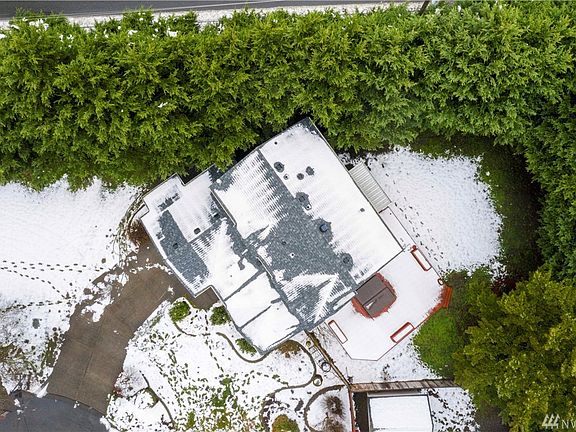 You can see the Beautiful private lot, on almost 1/3 acre.  There is a 750SF deck with hot tub, a covered concrete patio and it is fully fenced. You can also see the new roof