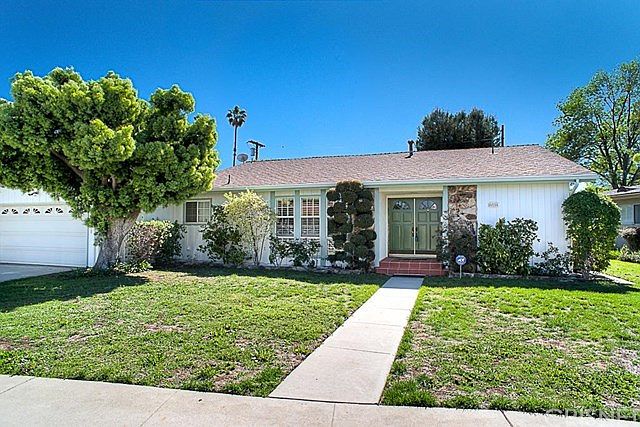 Handsome curb appeal with two car attached garage and direct access into the home.