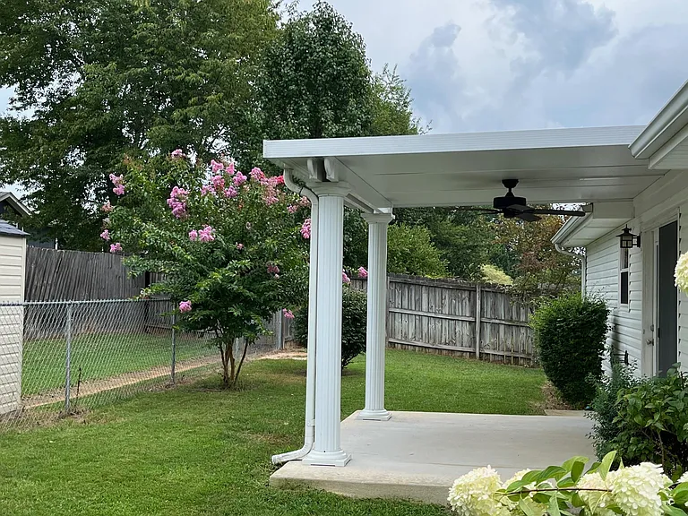 Covered patio area with ceiling fan