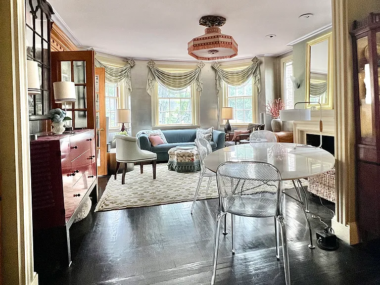 View towards past dining area towards living area within bay window.