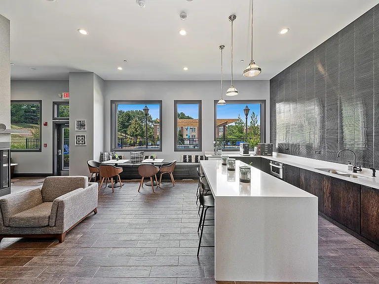Modern lounge with bar seating and work tables