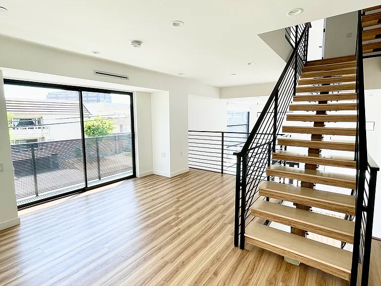 Mezzanine with Balcony. Flex space overlooking living room. Very functional space perfect for a home office