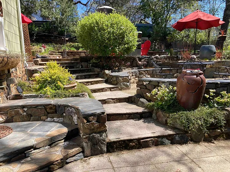 Well maintained yard with many rock terraced areas for sitting and relaxing.