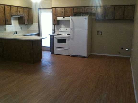 Kitchen with stove and refrigerator furnished