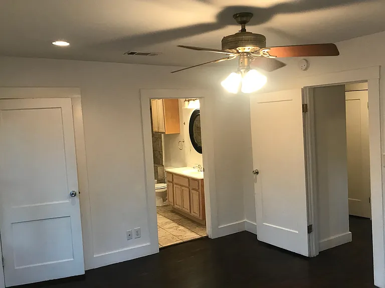 Master bedroom view to bathroom hall entry on right and left walk in closet