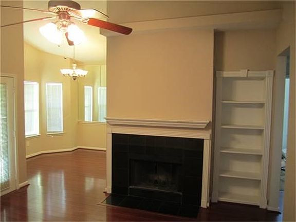 Another view of the fireplace and the built-in bookshelf.