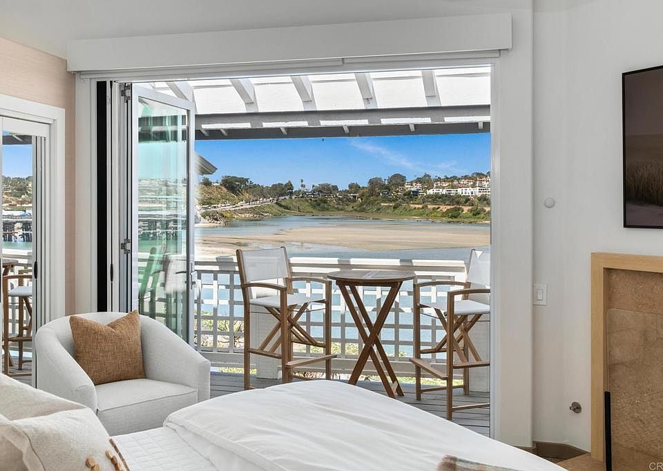Primary bedroom features a king size bed, views, fireplace and en suite bathroom