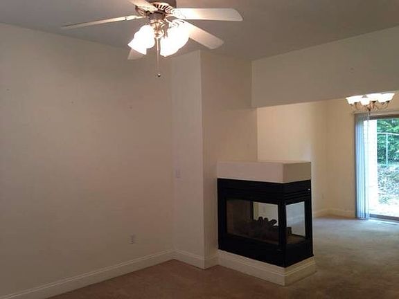 living room/dining room w/see thru gas fireplace, ceiling fa