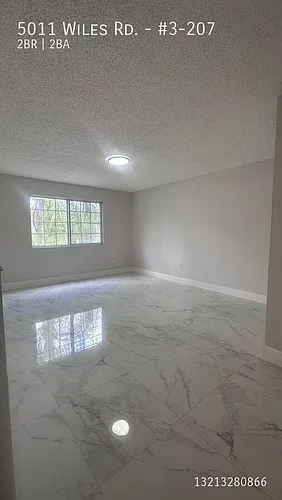 5011 Wiles Rd #3-207 Photo 1