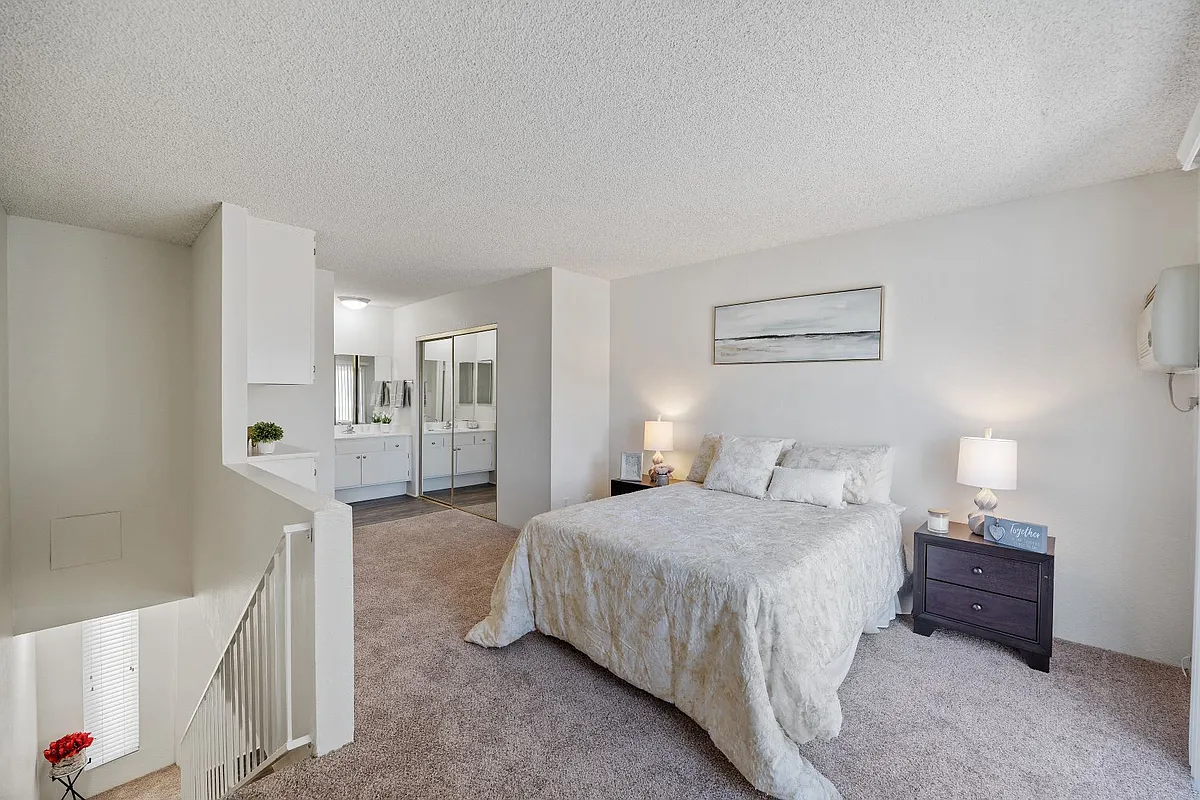 Bedroom and the bathroom in the one bedroom townhome apartment at the Esplanade Apartment in Van Nuys - The Esplanade
