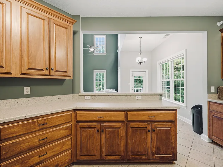Kitchen opens up into dining and living area