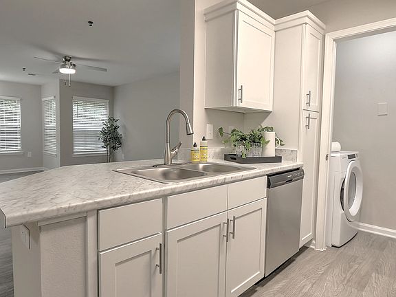 Kitchens designed for entertaining with luxury countertops and bar seating.