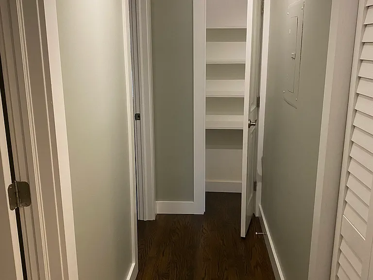 Hallway with storage closet