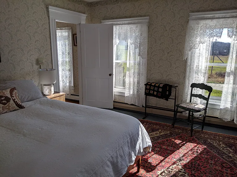 Bedroom 1, south facing windows look out over hay fields