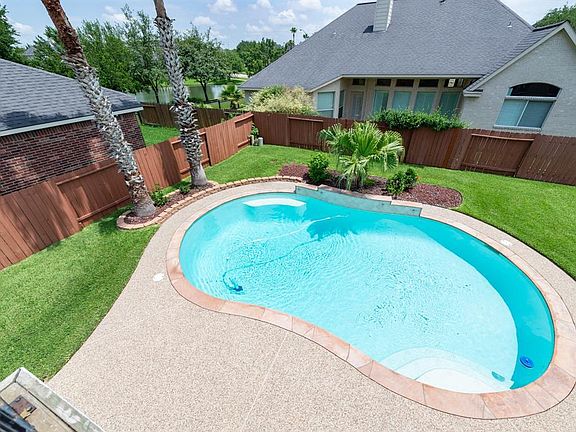 Summer is here--what better spot to relax in? This backyard offers an inviting pool, a shaded patio and plenty of yard for children and pets to run!