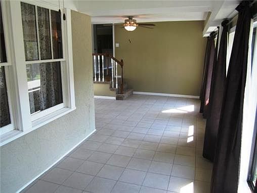 ENCLOSED BREEZEWAY WITH TILE FLOORING
