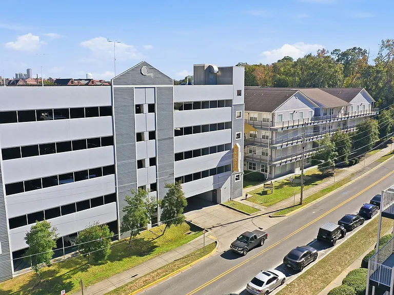 Enjoy Modern Living at Legacy Student Living with Well-Lit Parking and Stylish Architecture