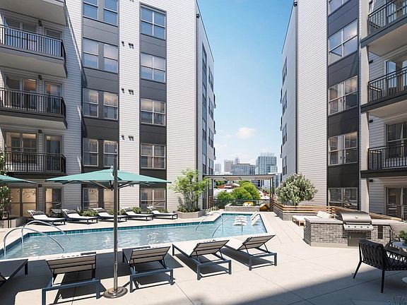 Resort-style pool with spacious sundeck and views of Midtown skyline.