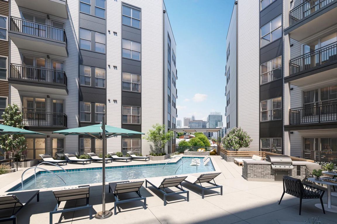 Resort-style pool with spacious sundeck and views of Midtown skyline.