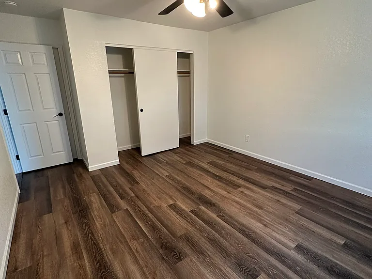 Master Bedroom view of closest and bathroom/door entrance