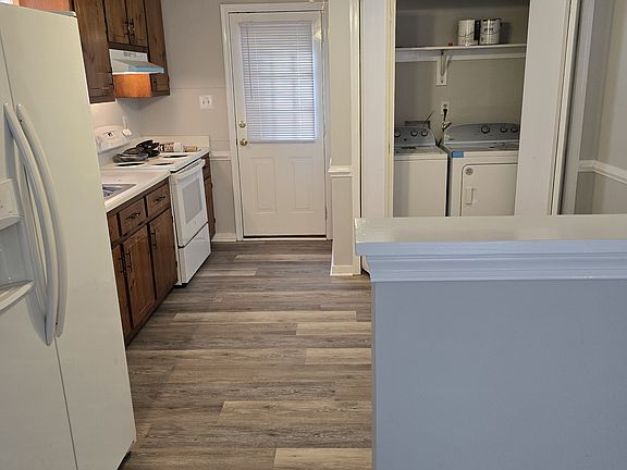 Kitchen with Fridge, Electric Stove, Brand New Washer/Dryer, Door to Rear Deck