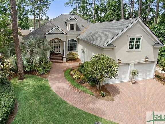 Lovely landscaping and paver driveway