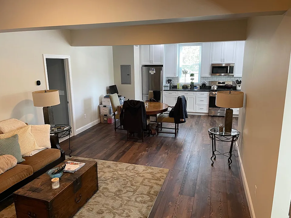 Large open concept first floor living room, dining area and kitchen.