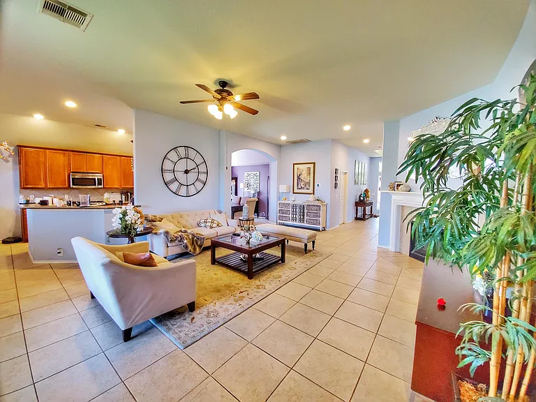 Open concept living room that opens to kitchen, breakfast room, and formal dining.