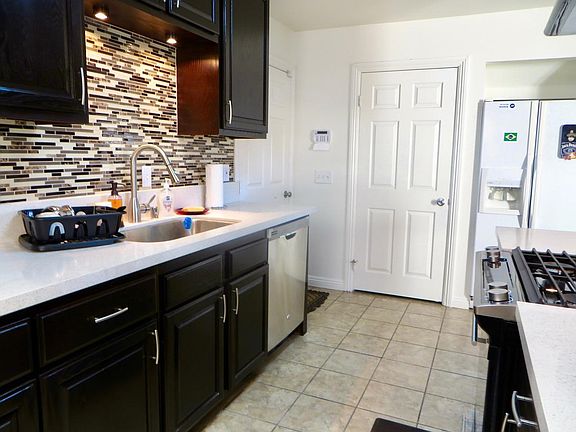 Next to the refrigerator - down stairs 1/2 bathroom